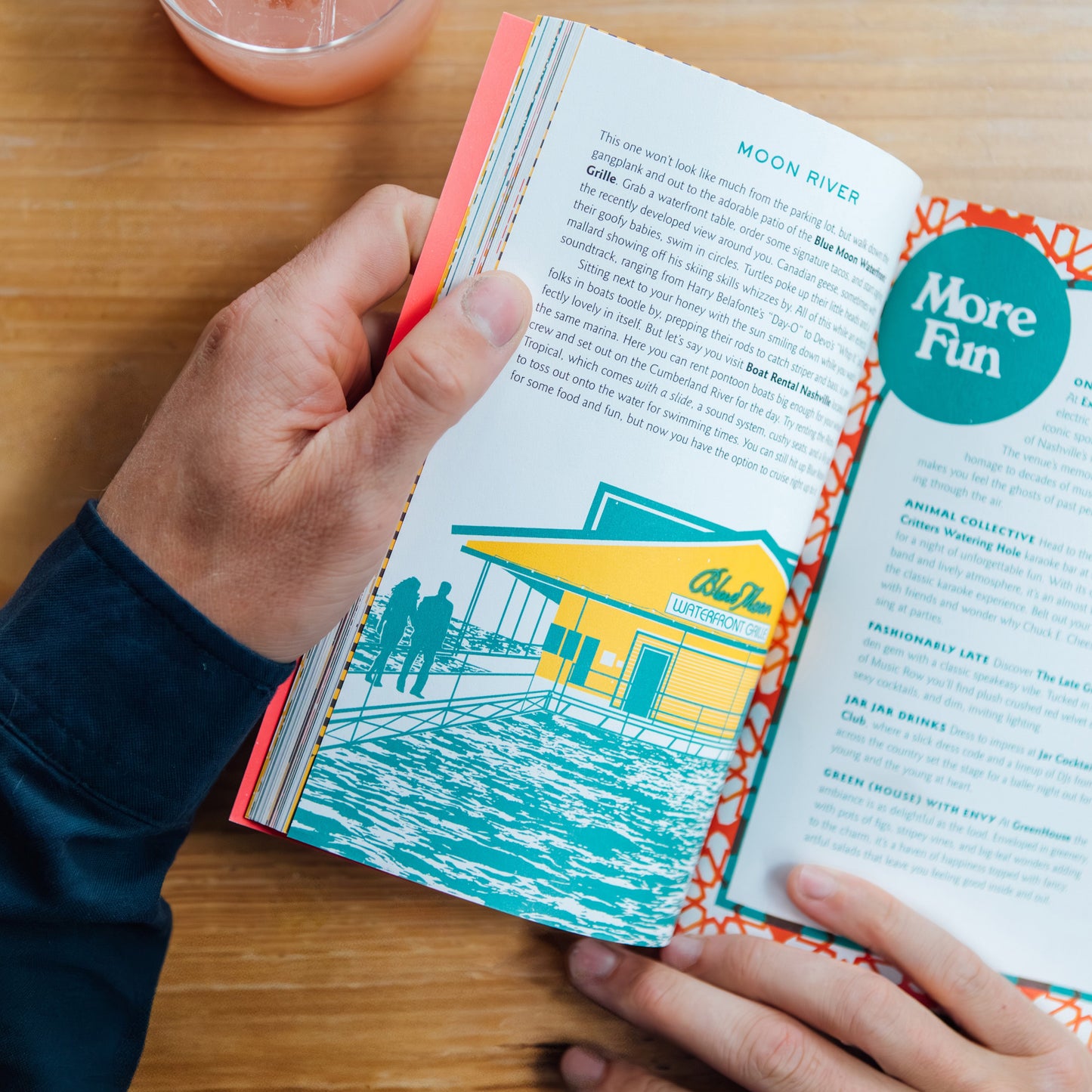 A person holding Nashville Book of Dates inside view showing "Moon River"