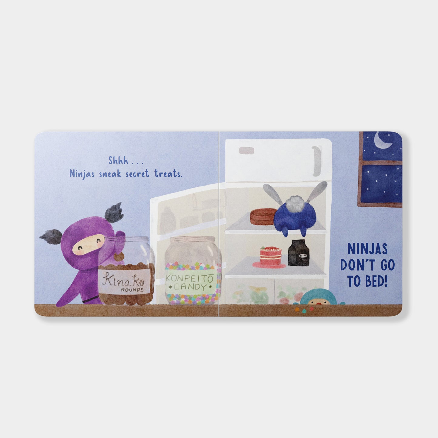 Children's book with illustrations of ninjas and a refrigerator on a white background