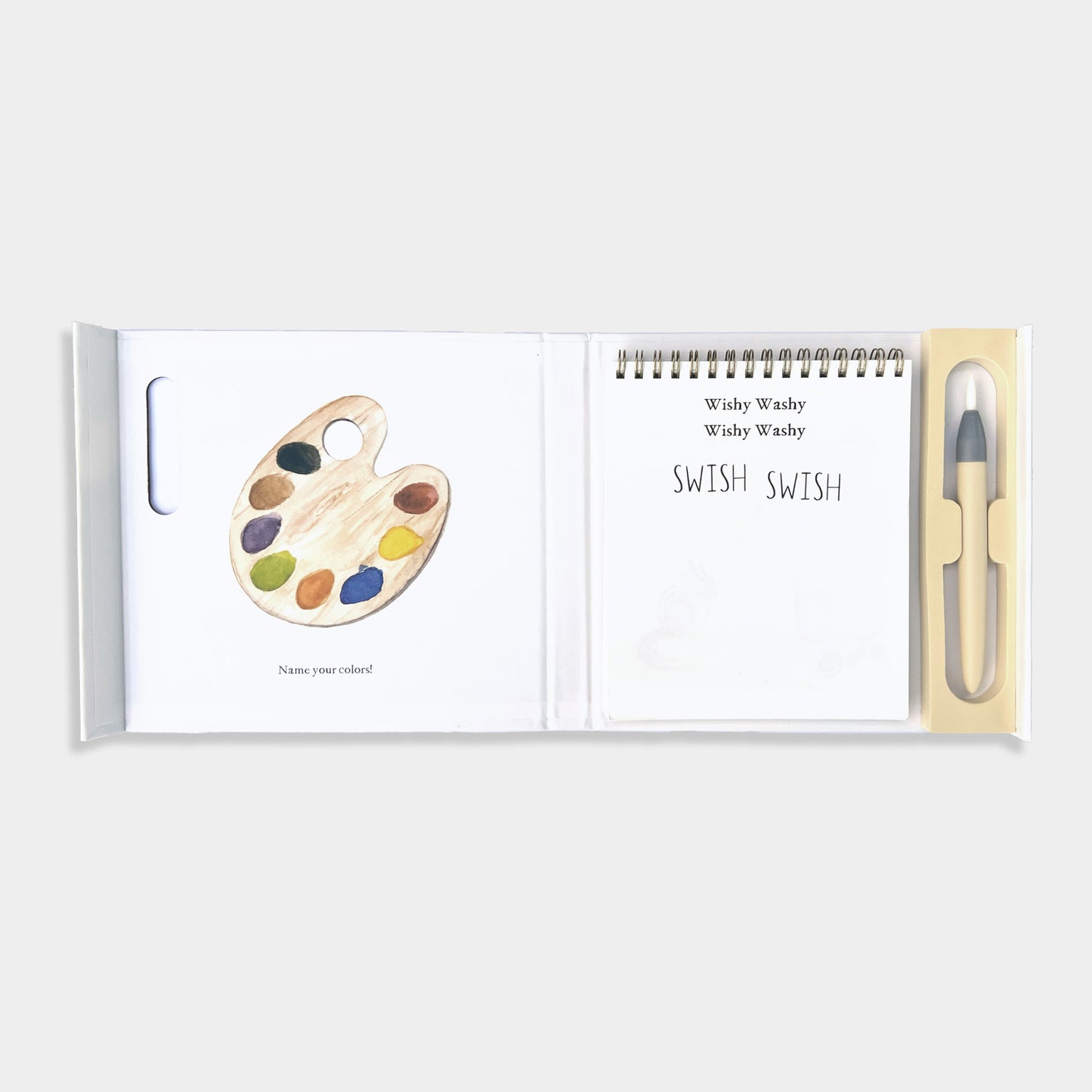 Wishy Washy Water Reveal book with paint palette and pen on a white background