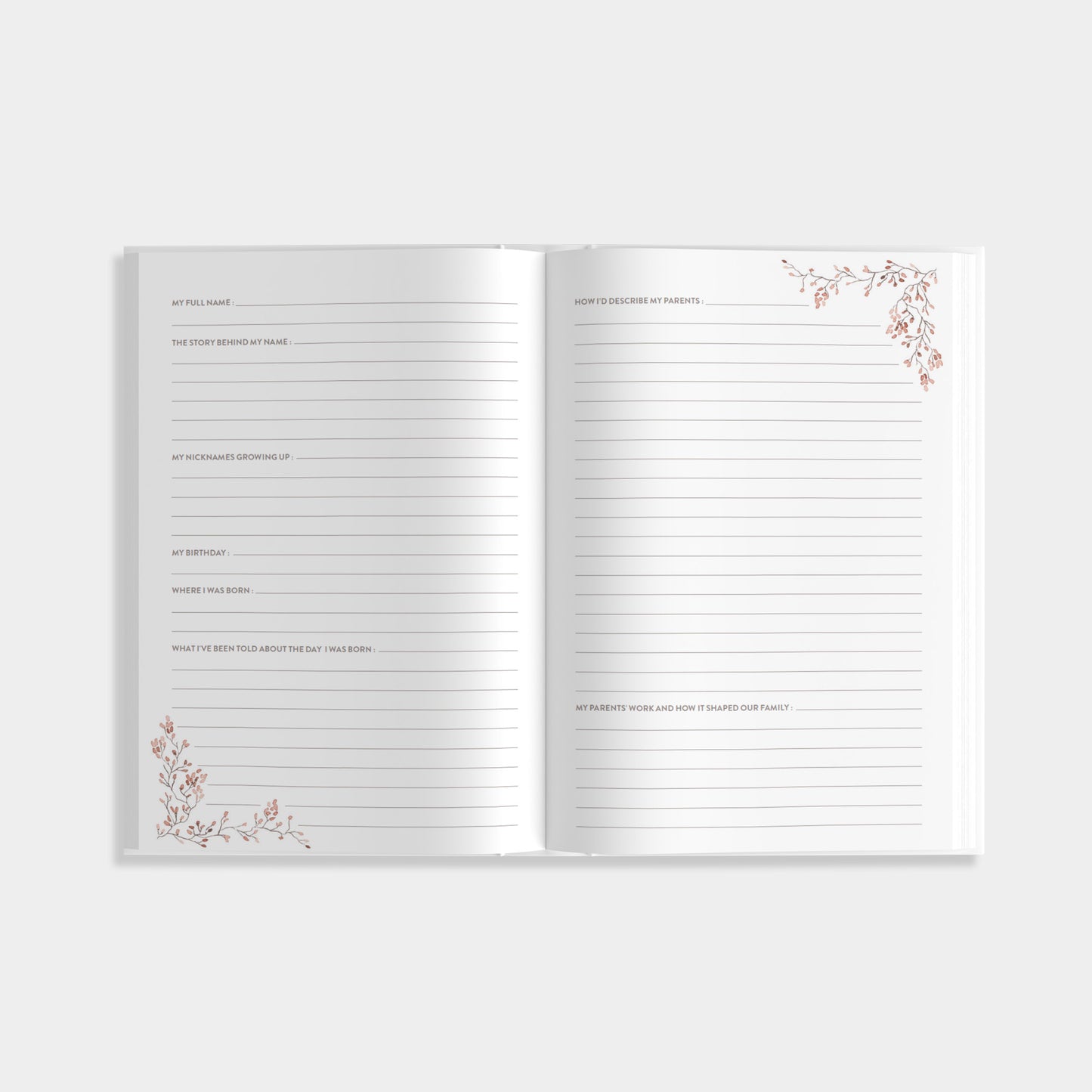 Open journal of Aunt's Story with lined pages of prompts that include the story behind your name and early childhood memories with decorative corners on a white background.