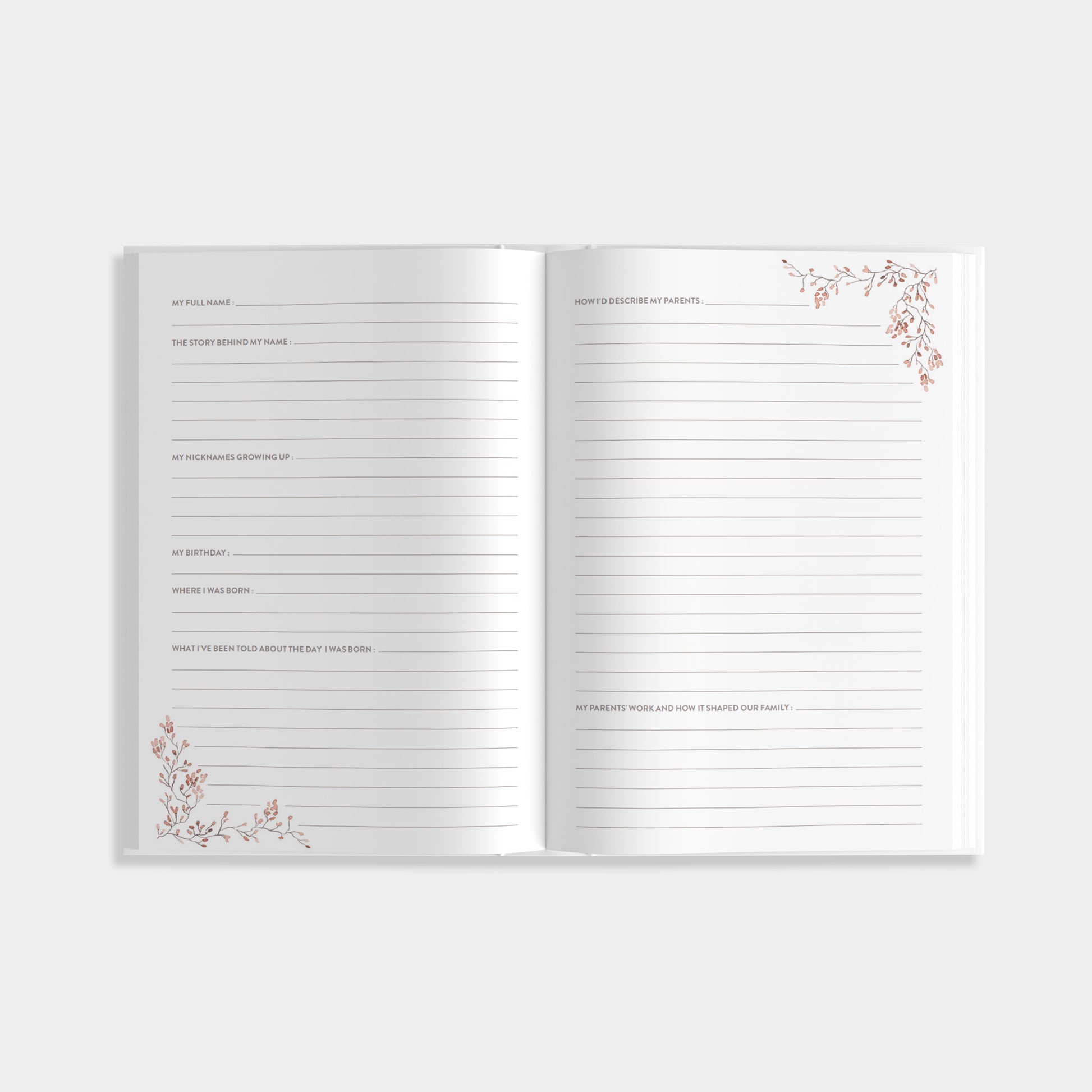 Open journal of Aunt's Story with lined pages of prompts that include the story behind your name and early childhood memories with decorative corners on a white background.