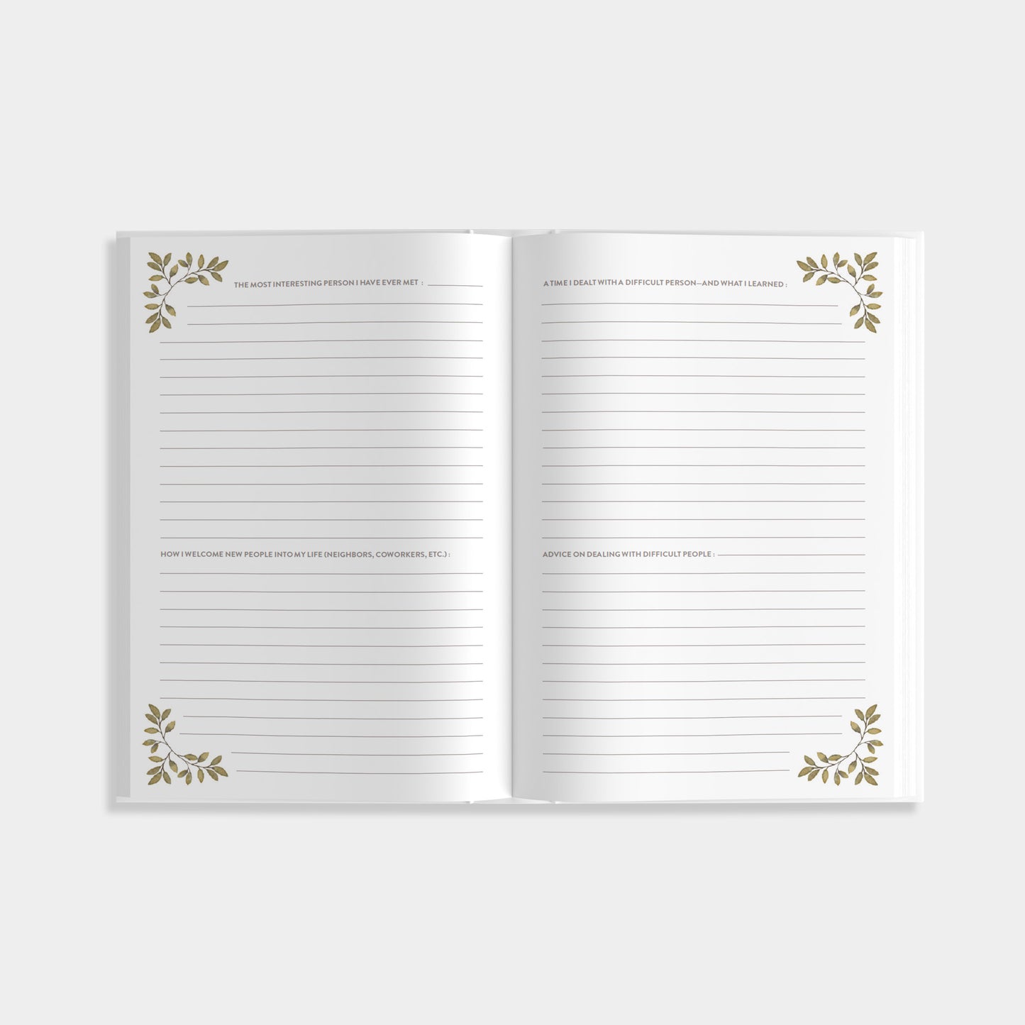 Open journal of Uncle's Sotry with prompts about personal life decorative leaves on a white background