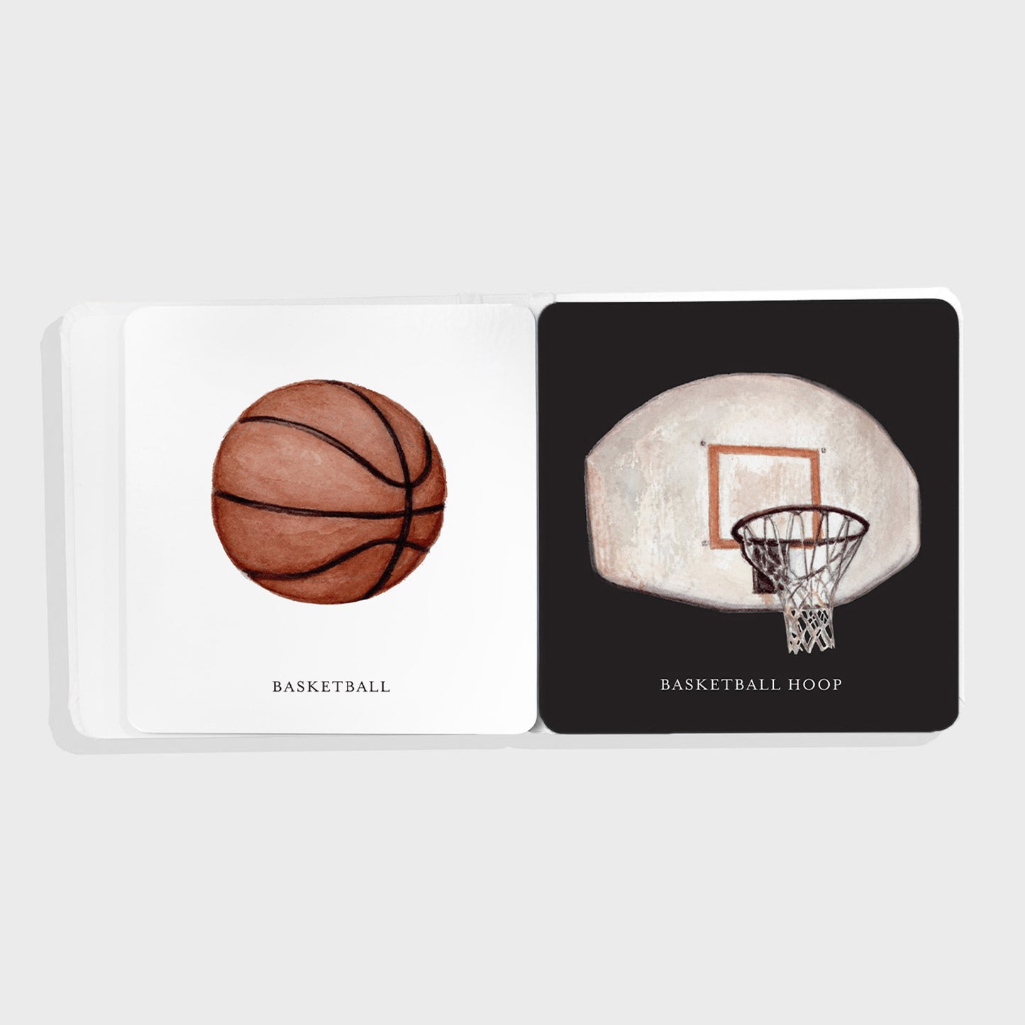 Illustrations of Baby's Tummy Time Sports books with two illustrations showing a basketball and a basketball hoop on a white background