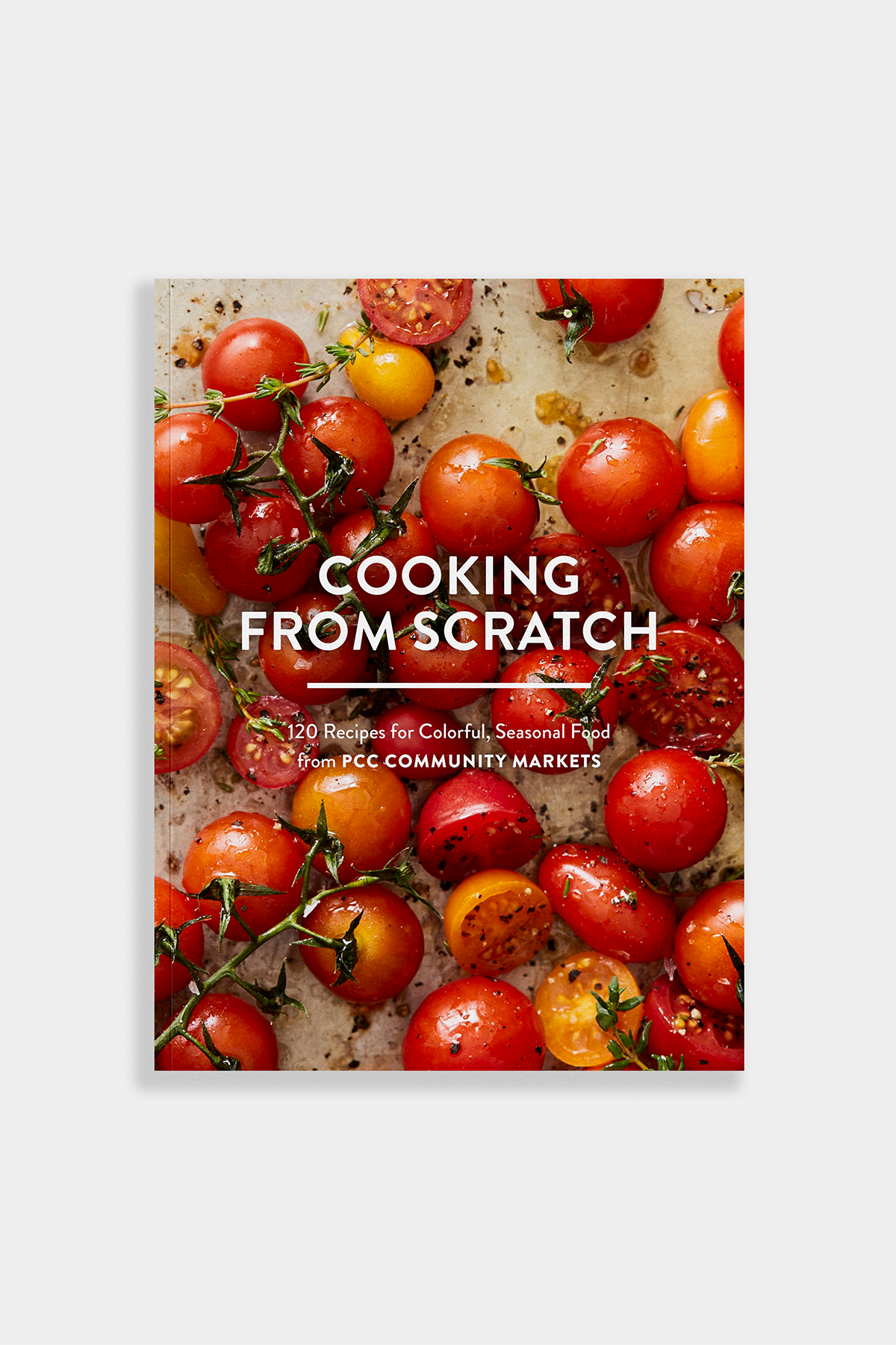 Book cover of 'Cooking from Scratch' with tomatoes on a white background