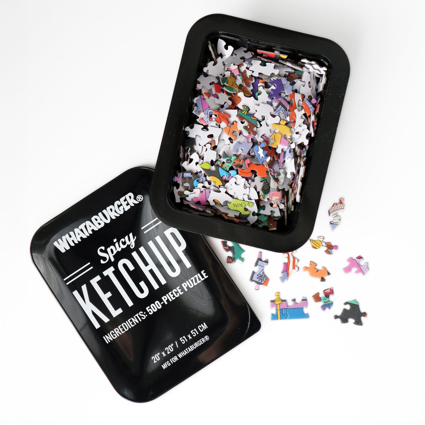 Jigsaw puzzle in a container labeled 'Spicy Ketchup' with scattered pieces on a white background