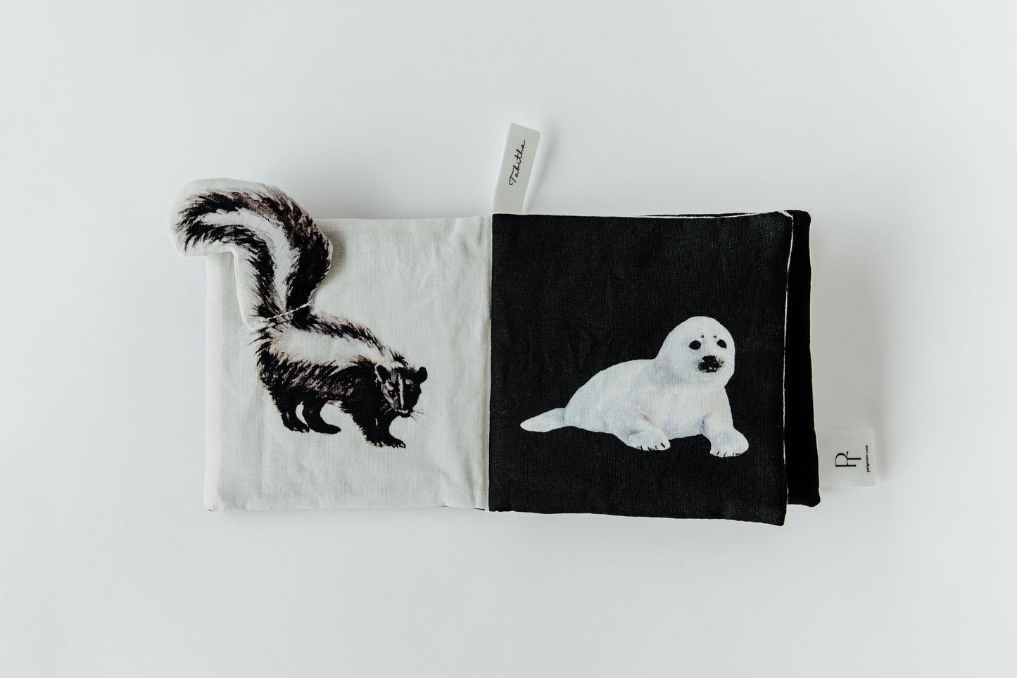 Two fabric pouches with animal illustrations on a white background