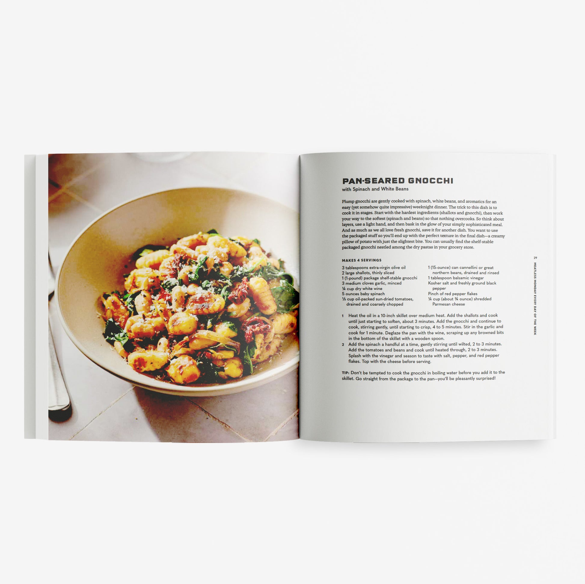 Open cookbook showing a bowl of pan-seared gnocchi with a recipe on a white background