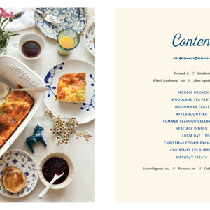 From the book: 'Scandinavian Gatherings' Table setting with a dish of food and a magazine page titled 'Contents' on a white background.