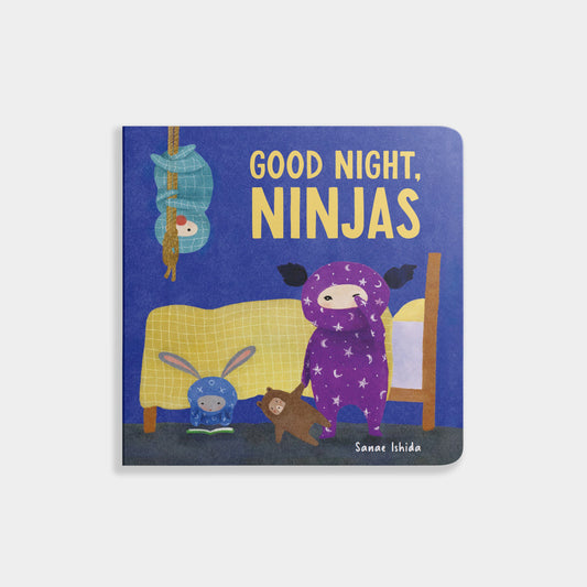 Book titled 'Good Night, Ninjas' with illustrations of children in pajamas and a teddy bear on a blue background.