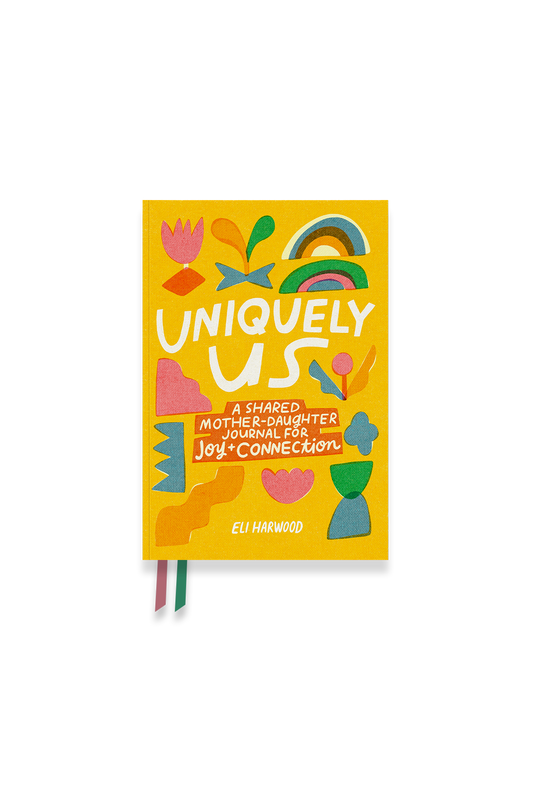 Colorful journal titled 'Uniquely Us' on a white background