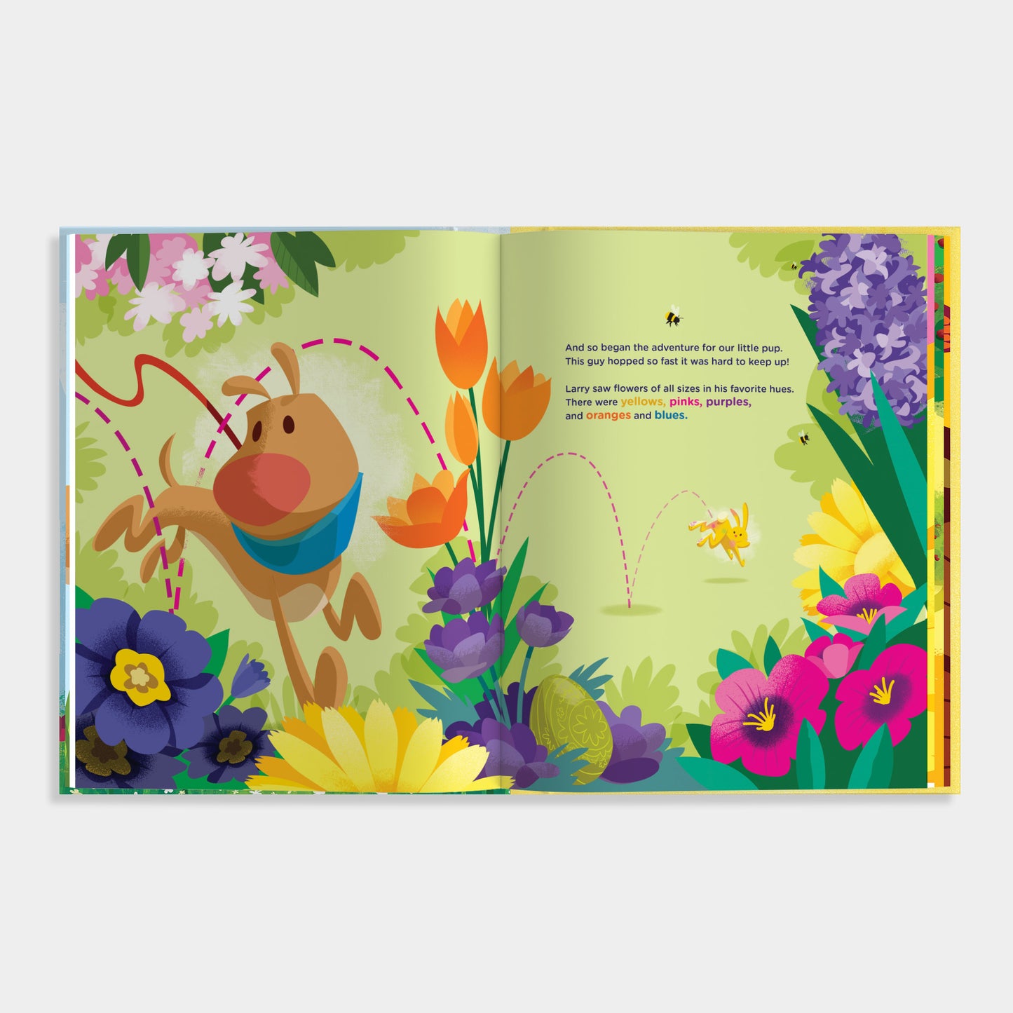Open book with colorful illustration of a dog and flowers on a white background