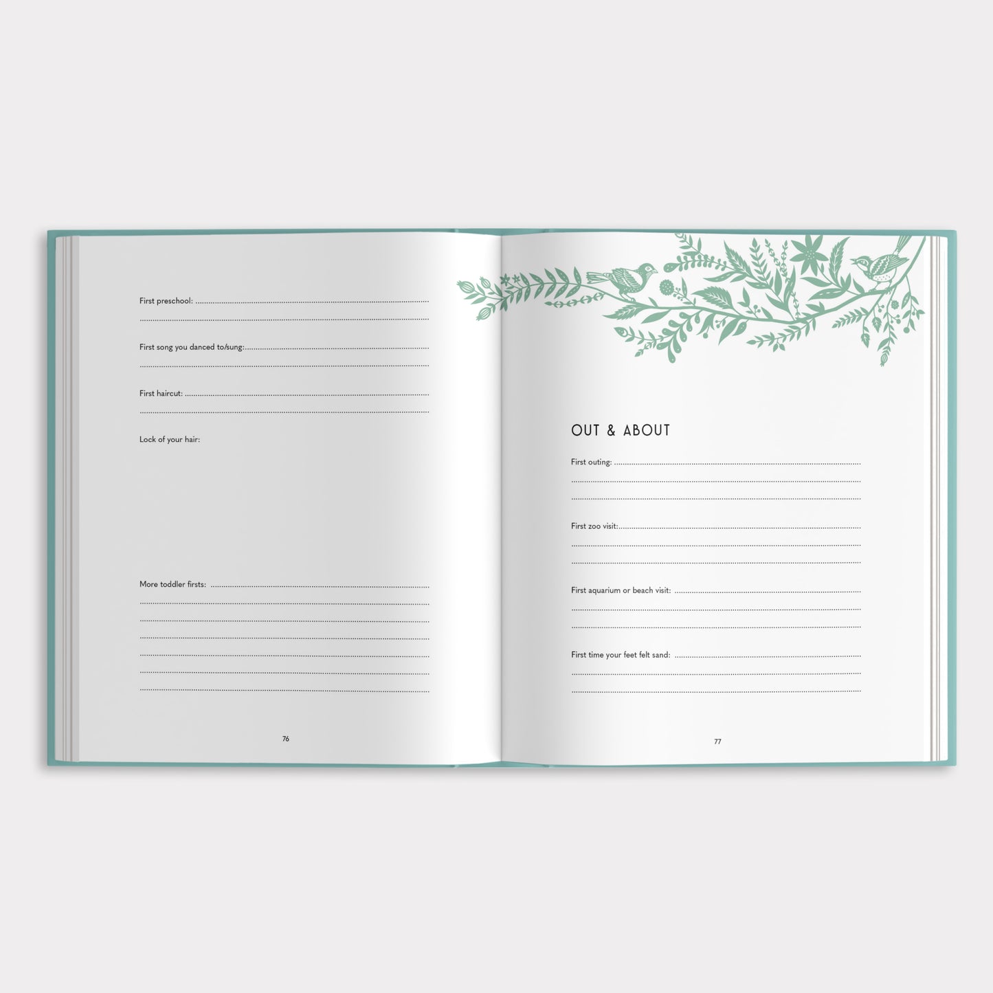 Open book with green leaf design on a white background