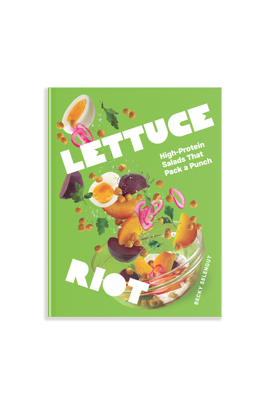 Lettuce Riot has a green cover with a blow of vegetables and fruit jumping out of it. Subtitle says: High-Protein salads that pack a punch 