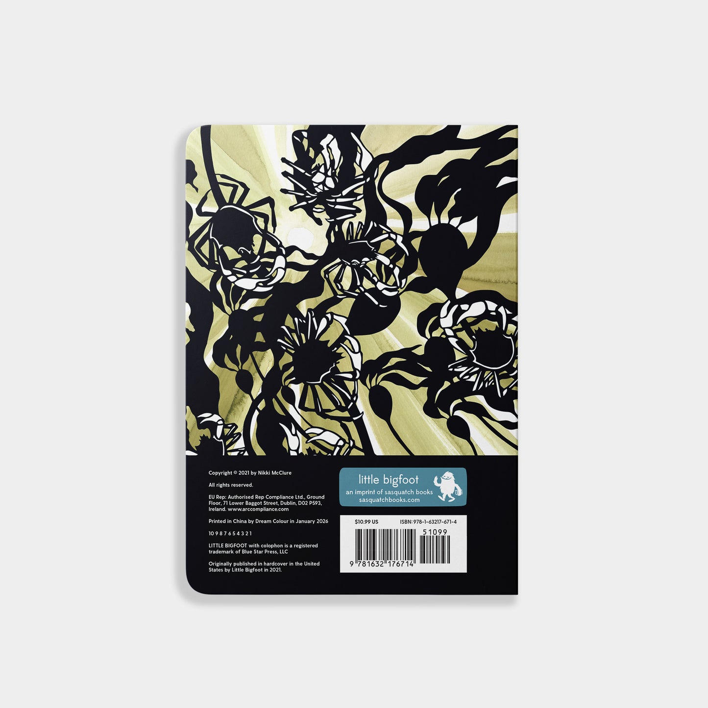 Notebook with black floral design on a beige background