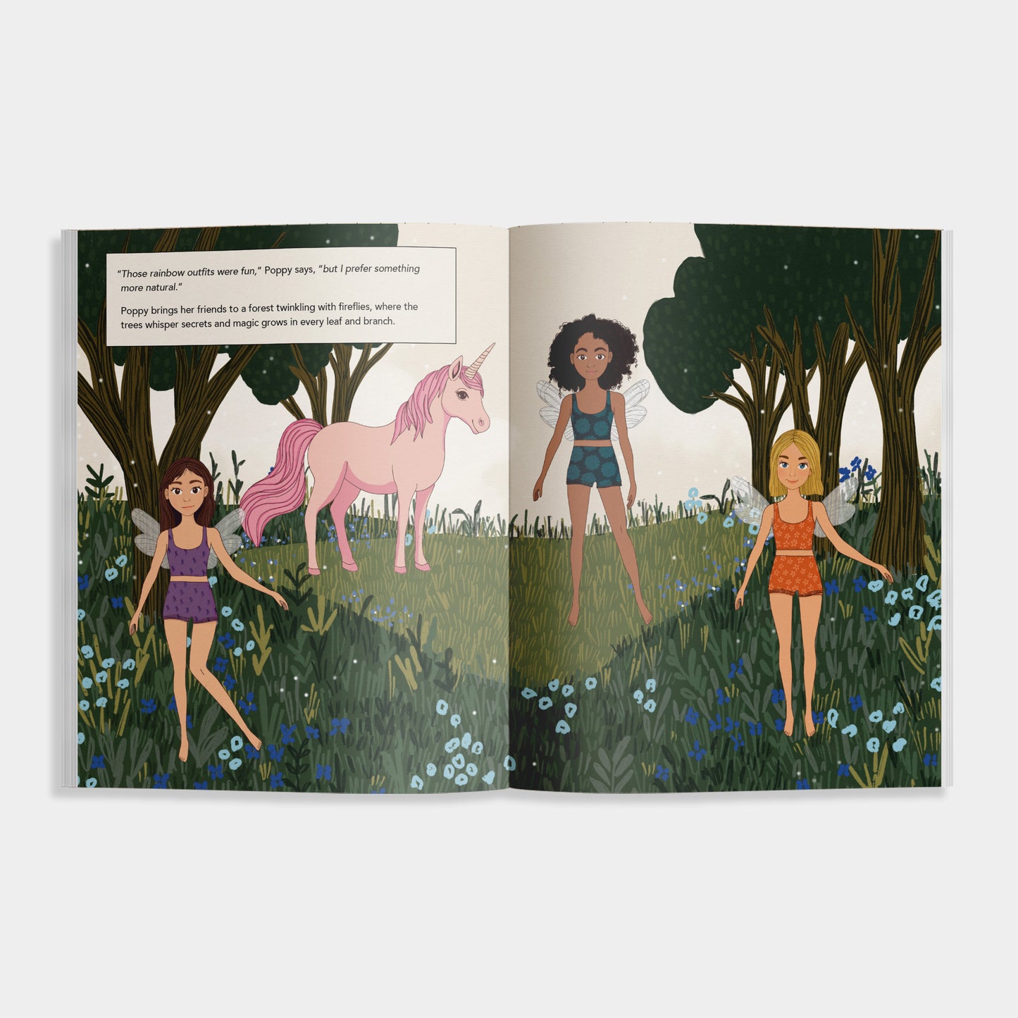 Interior pages of “My Sticker Storybook: Fairies & Unicorns” showing three illustrated fairies and a pink unicorn in a magical forest scene with wildflowers and trees, accompanied by a short story excerpt