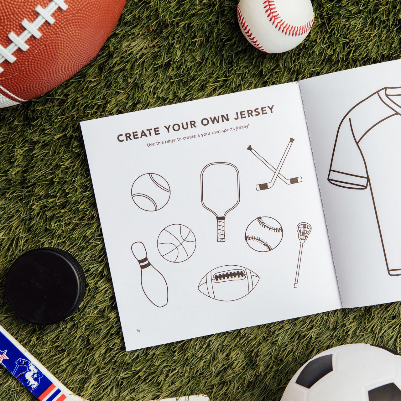 Children's activity book with sports-themed designs on grass with sports equipment.