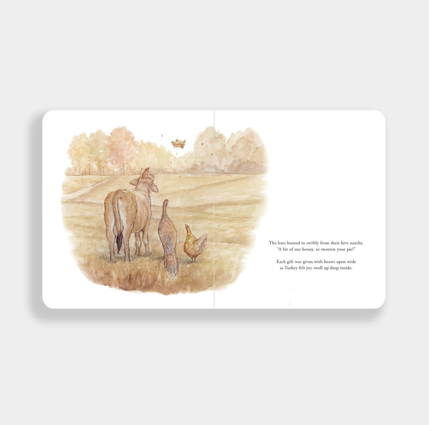 An open children's picture book spread showing a watercolor illustration of a cow, chicken, and duck in a field, with a short poem printed on the right page, photographed on a light gray background.