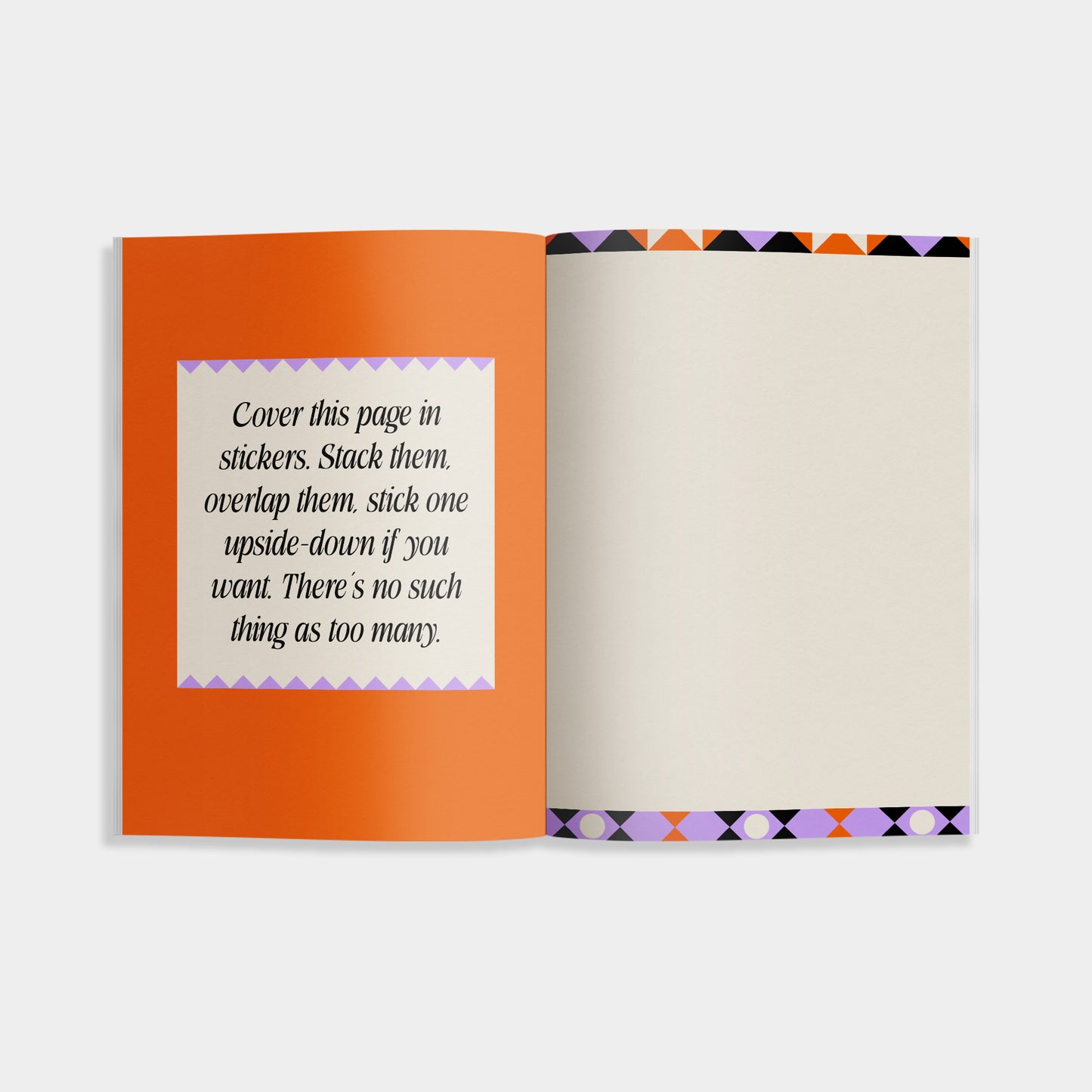 Open book with text and decorative border on a white background
