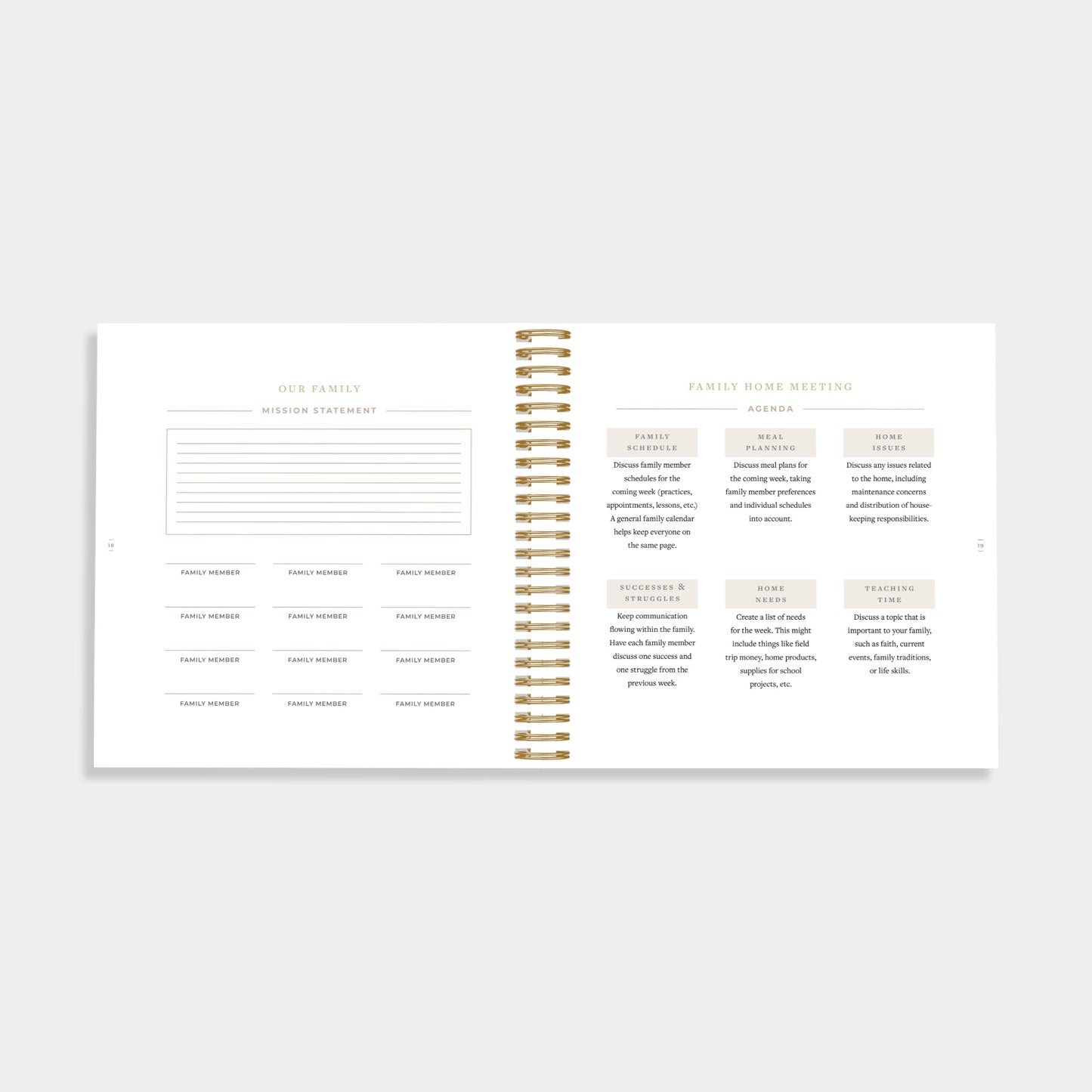 An open spiral-bound planner or notebook showing two white pages with printed family event templates and sections, photographed on a light gray background.
