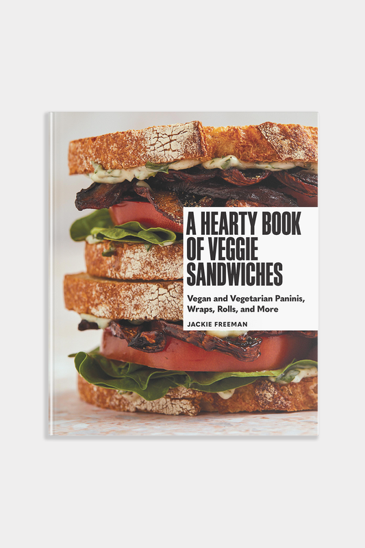 Book cover of 'A Hearty Book of Veggie Sandwiches' with a sandwich image on a white background