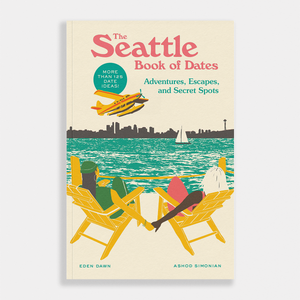 Book cover of 'The Seattle Book of Dates' with a scenic illustration of a city skyline and people on lounge chairs.
